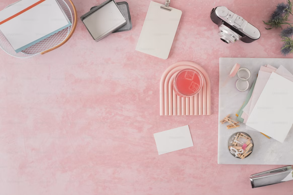Soft pink flatlay with planner and pen